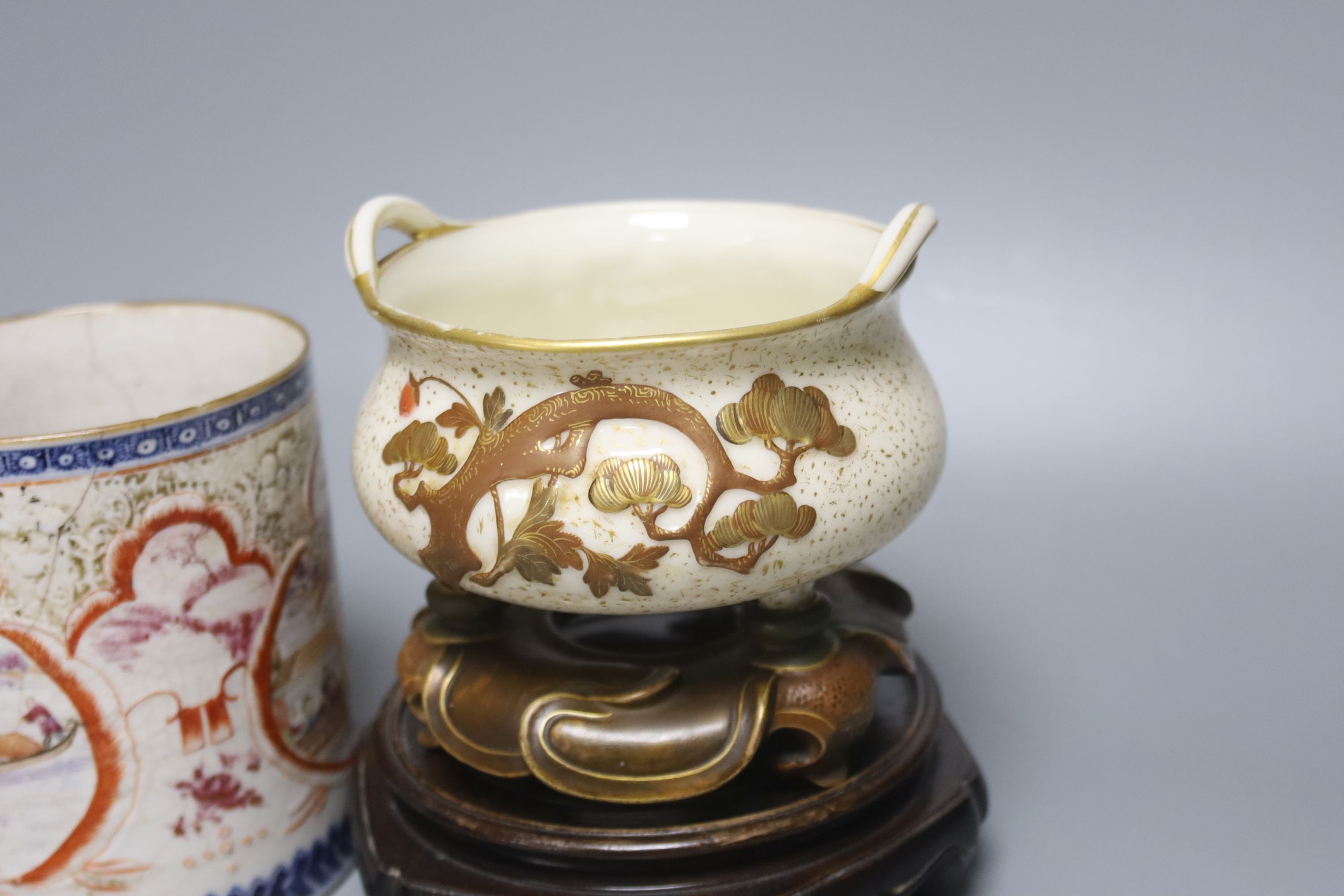 A Royal Worcester chinoiserie incense burner and integral stand, late 19th century, 11.5cmwide, wood stand and an 18th century Chinese export rose famille mug, with later metal handle